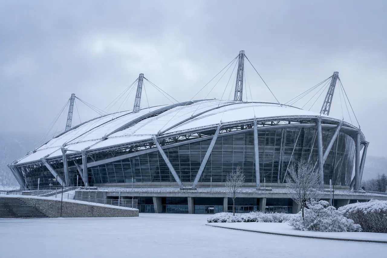 Modern stadium with a cable-stayed roof carrying a snow load